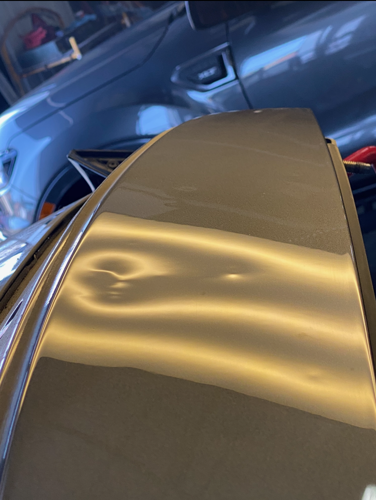 Trunk dent before and after repair