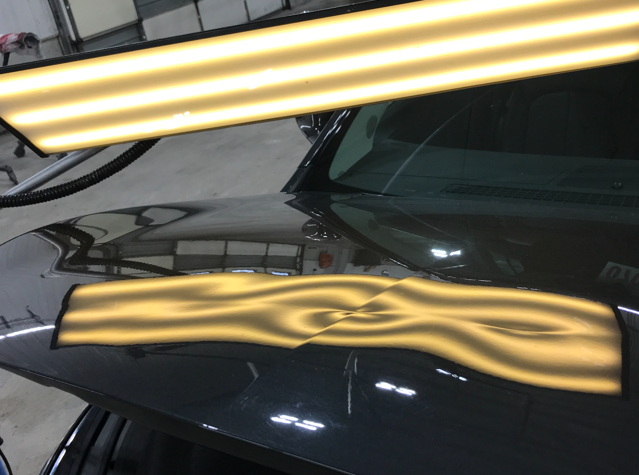 Hood dent before and after repair