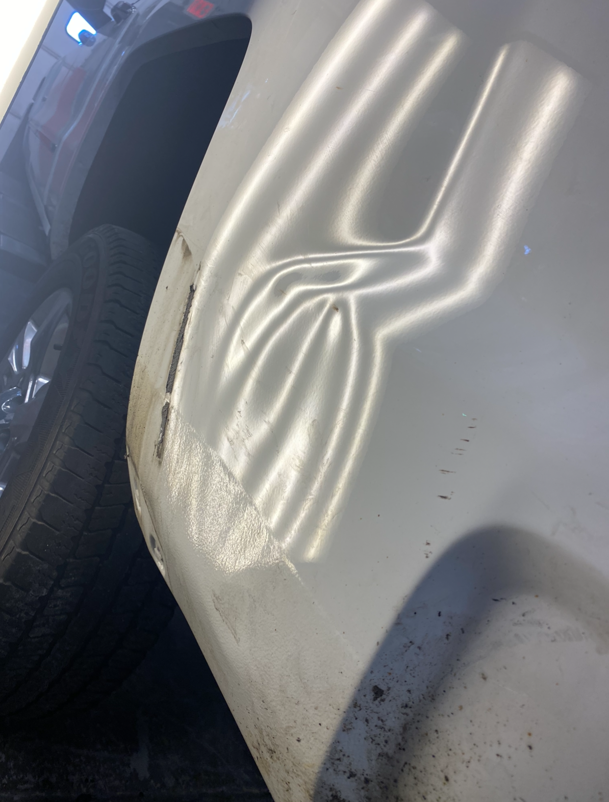 Side panel dent before and after repair